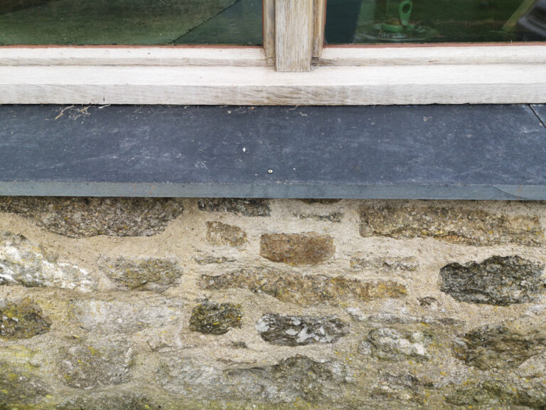 Slate sills with repointing granite wall